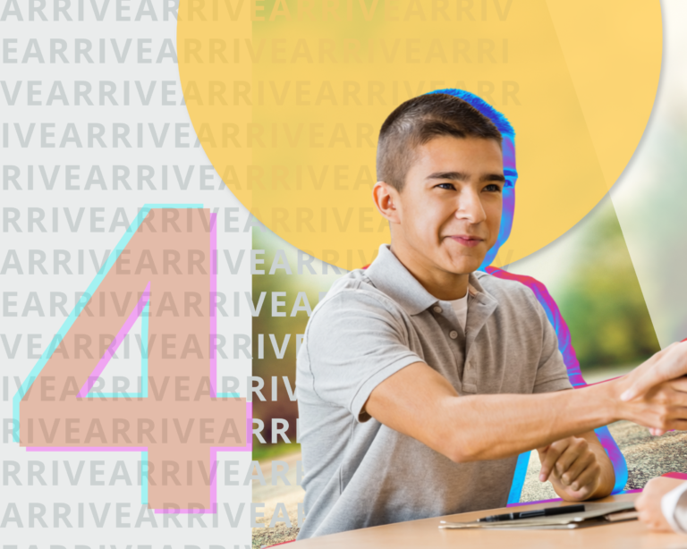 Seated young man shaking someone's hand across the table.
