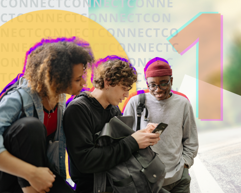 Three young adults look at a cell phone.